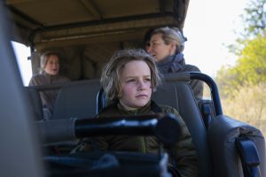 young boy in safari vehicle,Okavango Delta, Botswana